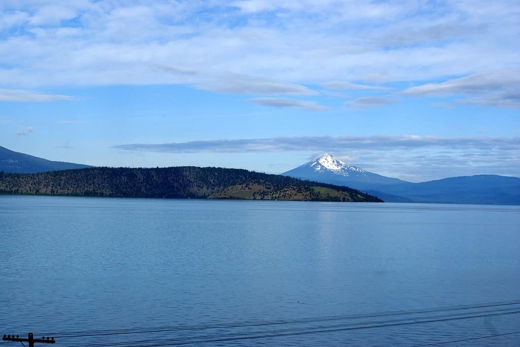 Upper Klamath Lake, shallow freshwater lake east of Cascade Range in south-central Oregon, USA , rich in fish, blue green algae, snow covered peak of Mt. McLoughlin in background.