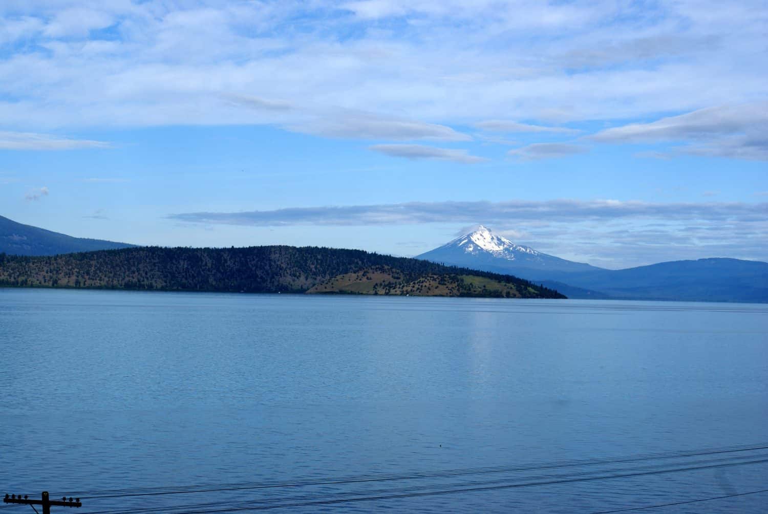Upper Klamath Lake, shallow freshwater lake east of Cascade Range in south-central Oregon, USA , rich in fish, blue green algae, snow covered peak of Mt. McLoughlin in background.