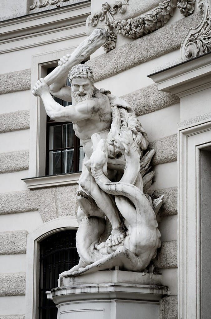 Statue of Heracles defeating the lernaean hydra in Vienna, detail of Hofburg imperial palace facade from Michaelerplatz square