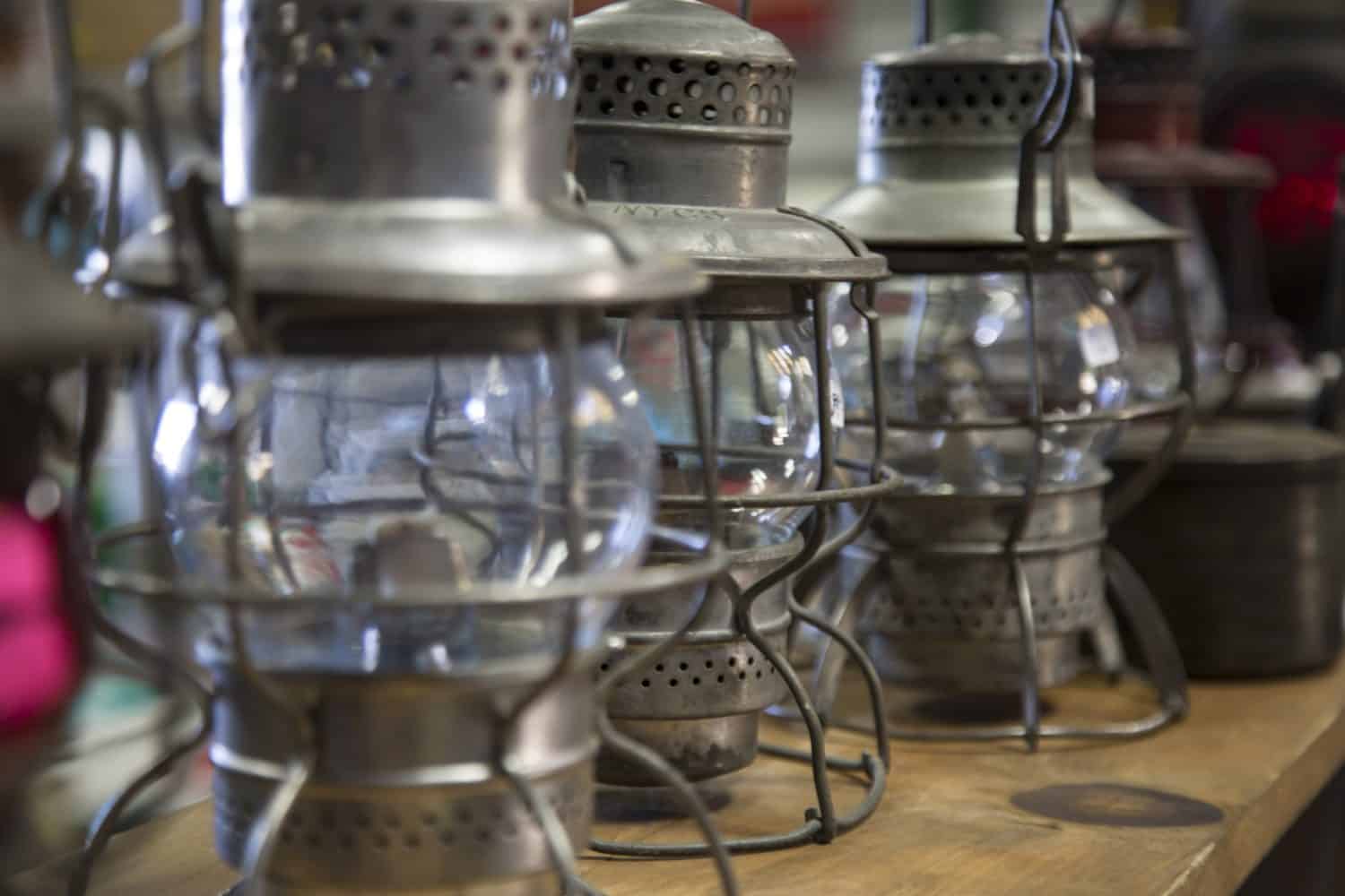 Isolated View of Antique Kerosene Camping Lanterns on Tabletop