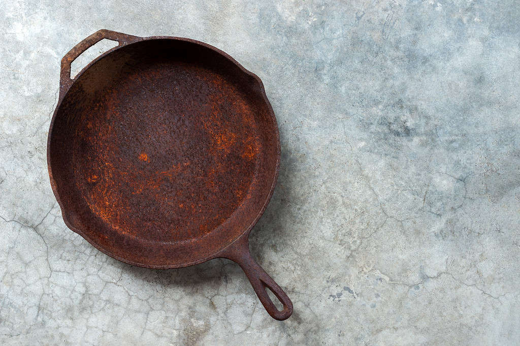 rusty cast iron frying pan
