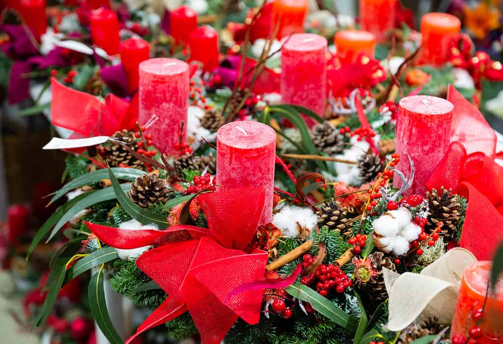 Handmade decorative candles in christmas style in home goods shop