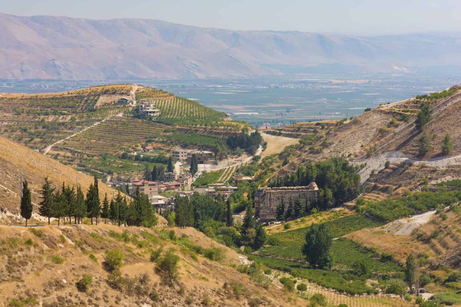 Panorama of the Bekaa Valley landscape with the Niha Roman temple, vineyard hills and mountains, in Zahle, Lebanon