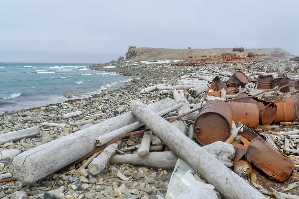 Abandoned transport, equipment and buildings of the Russian polar station, the Novaya Zemlya Archipelago, the Arctic.