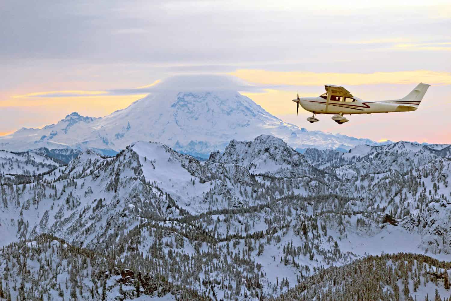 Recreational flying over picturesque snow covered mountains