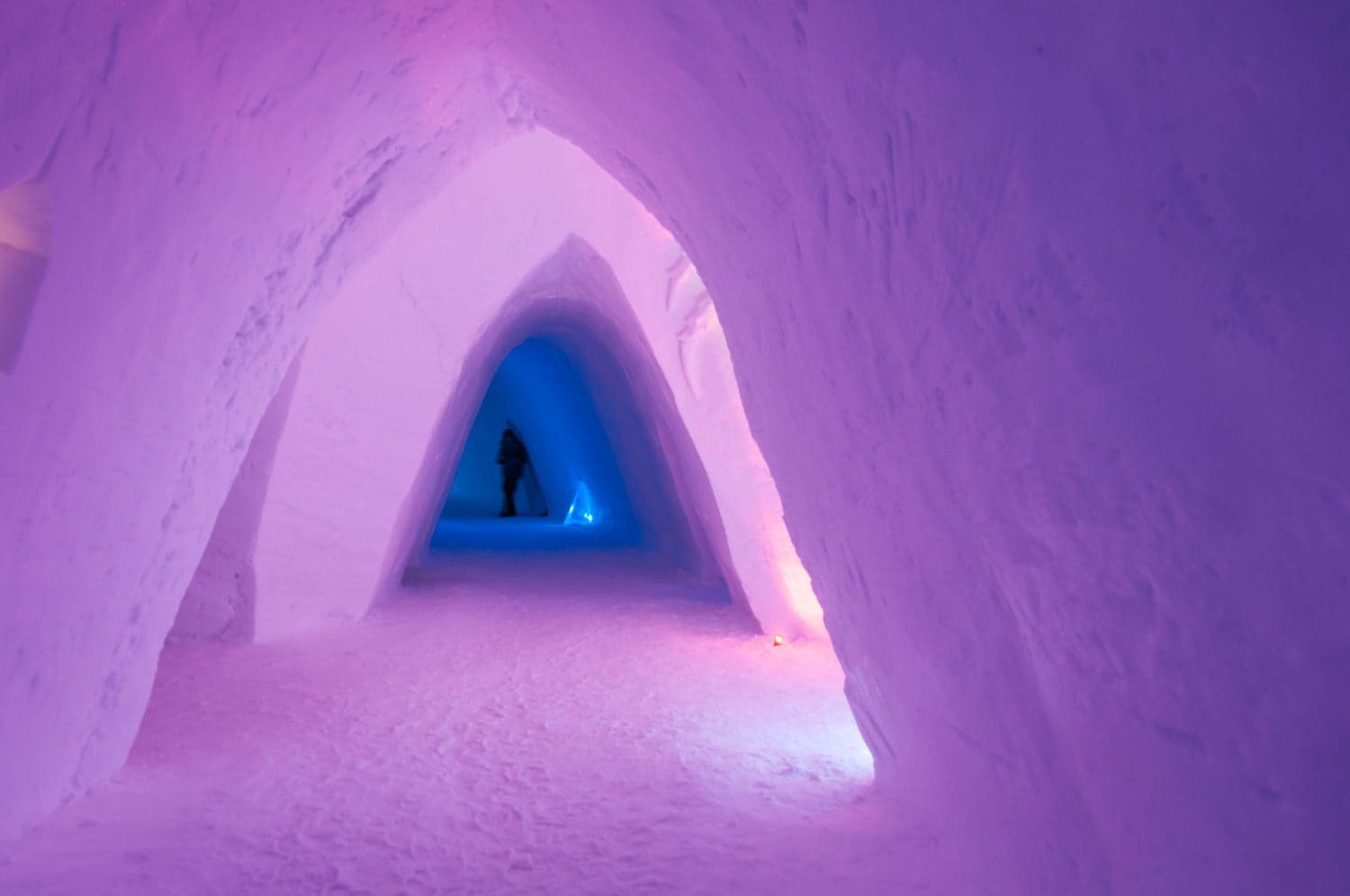Colorful pink entrance made of ice at the Snow Hotel, Kirkenes, Norway