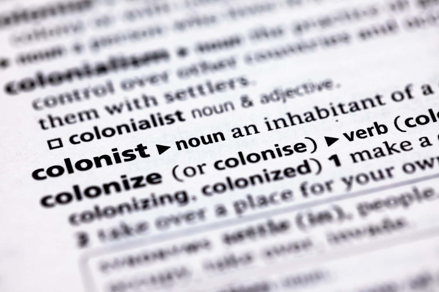 Blurred close up to the partial dictionary definition of Colonist