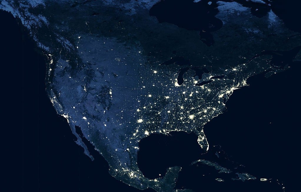 USA map at night, view of city lights from space. US, Canada and Mexico on dark map in global satellite picture. United States territory glowing in North America. Elements of image furnished by NASA.