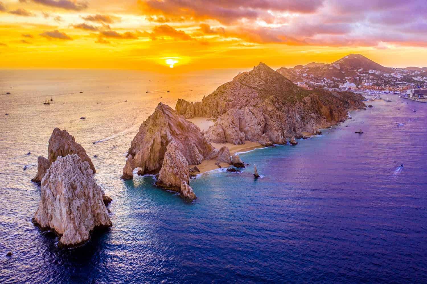 Aerial view of Land's End, Cabo San Lucas, Mexico at sunset, Baja California Sur, with the Cabo San Lucas marina in the background