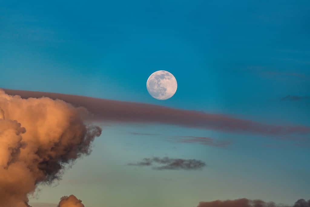 March full moon rise, the worm moon with blue sky backgrounds