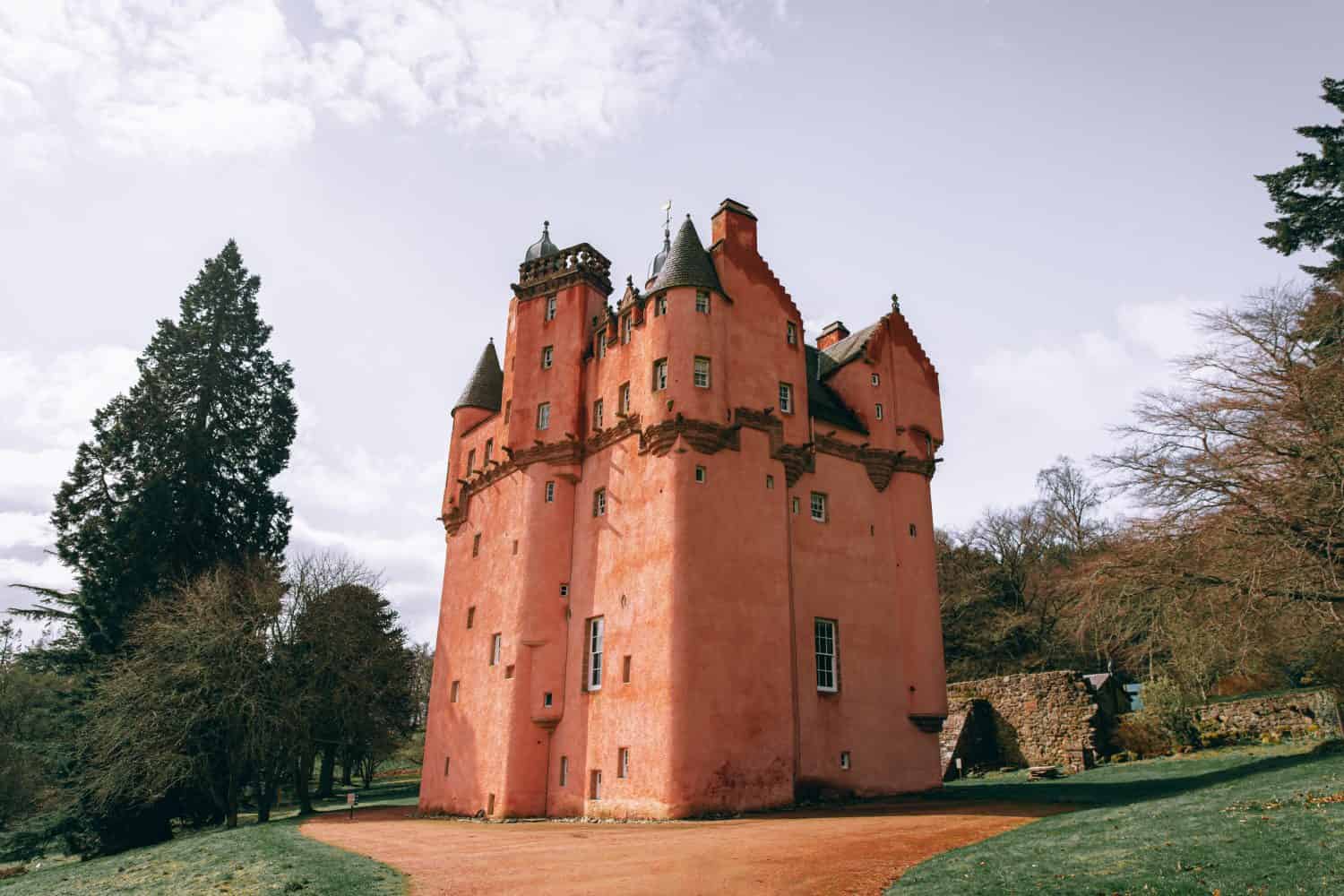 Craigievar Castle, Scotland. Beautiful pink castle that inspired Disney’s Cinderella Castle. Scottish Baronial style from 1576, exterior unchanged 1626. Pink castle photographed at Golden Hour.