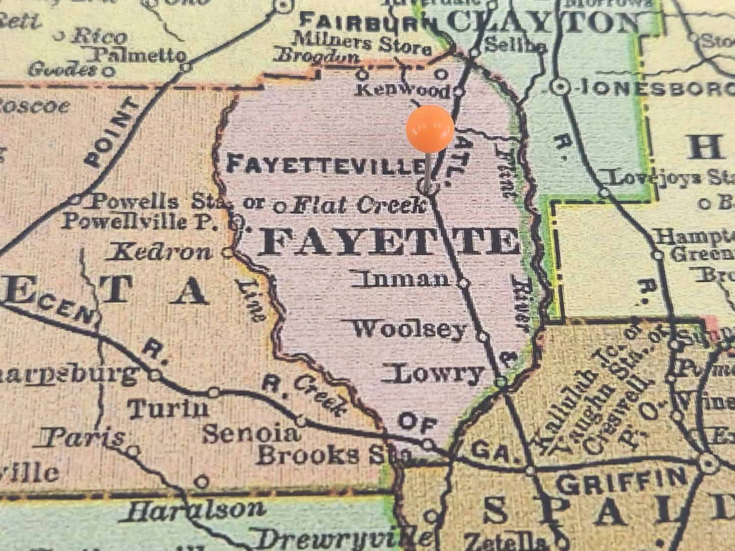 Fayette County, Georgia marked by an orange tack on a colorful vintage map. The county seat is located in the city of Fayetteville, GA.