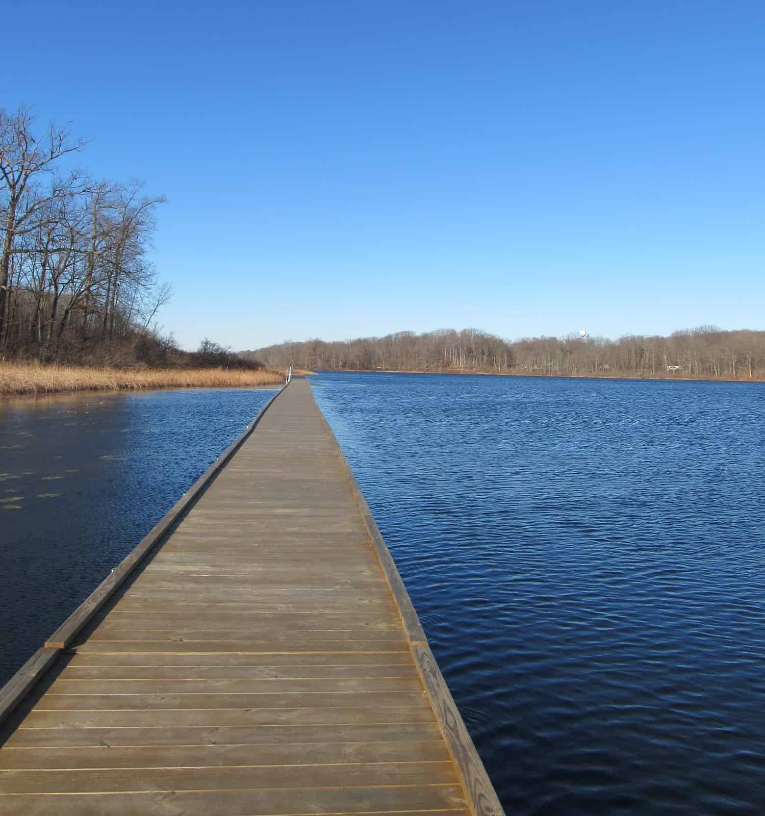 A pier over a lake at Punderson State Park.