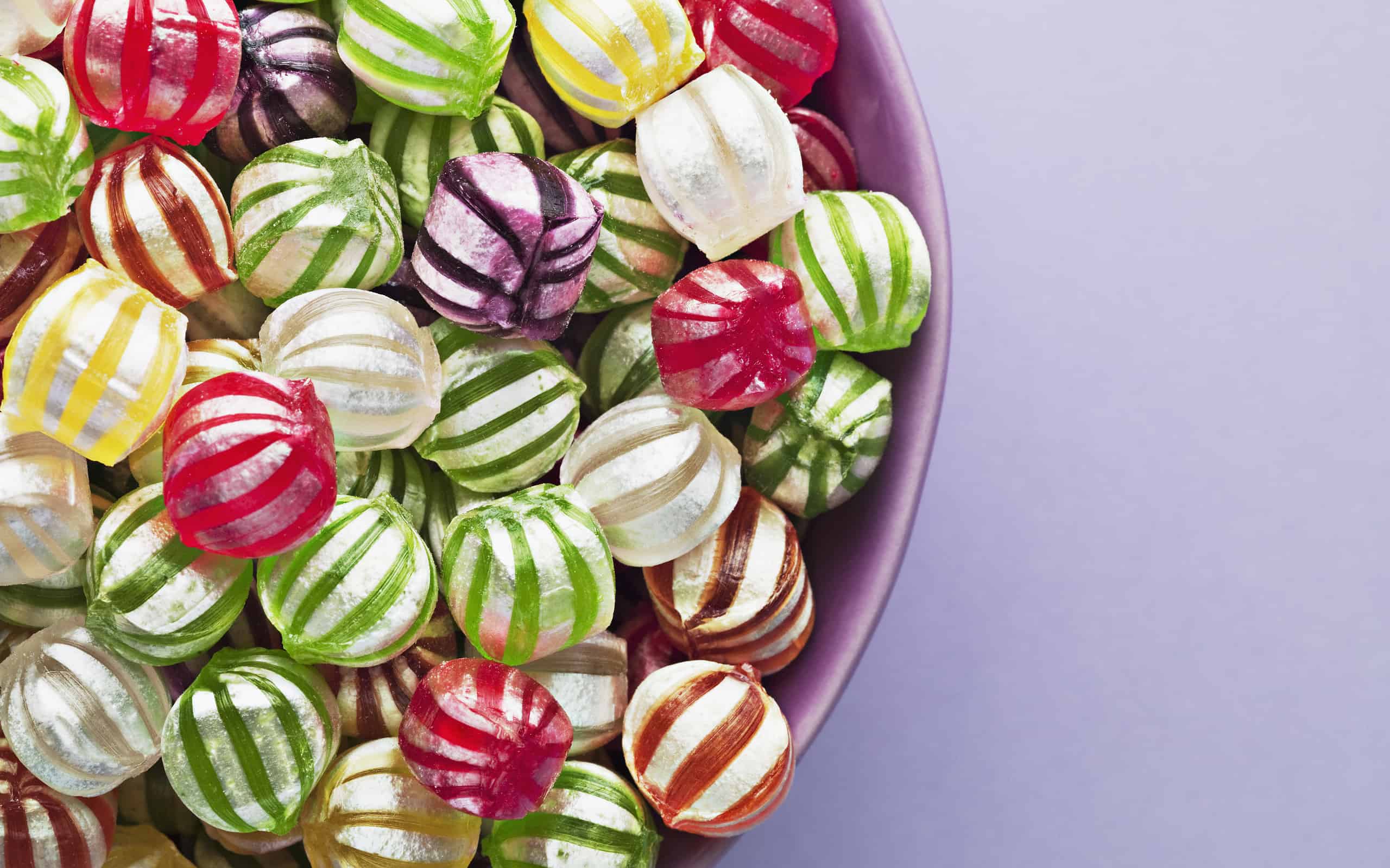 Close up of vibrant hard candy in bowl