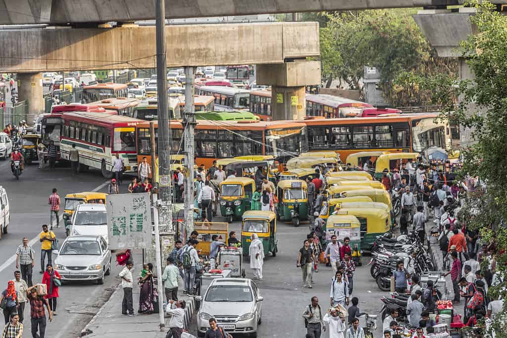 Big trafic with TukTuks, busses and people in New-Delhi, Delhi, India