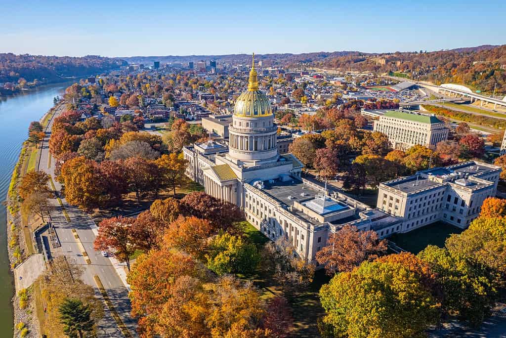 Aerial view of the West Virginia State Capitol Building and downtown Charleston with fall foliage