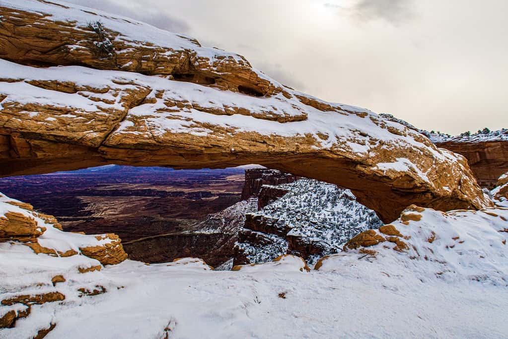 Beautiful shot of the Mesa Arch in snow in Canyonlands, Utah