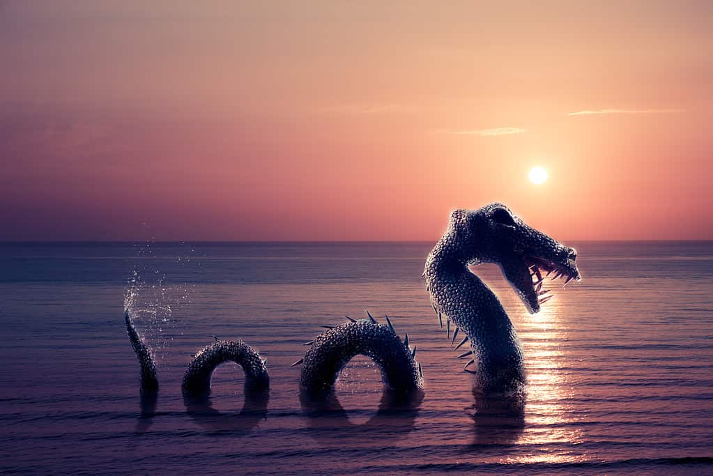 Loch Ness Monster emerging from water at sunset