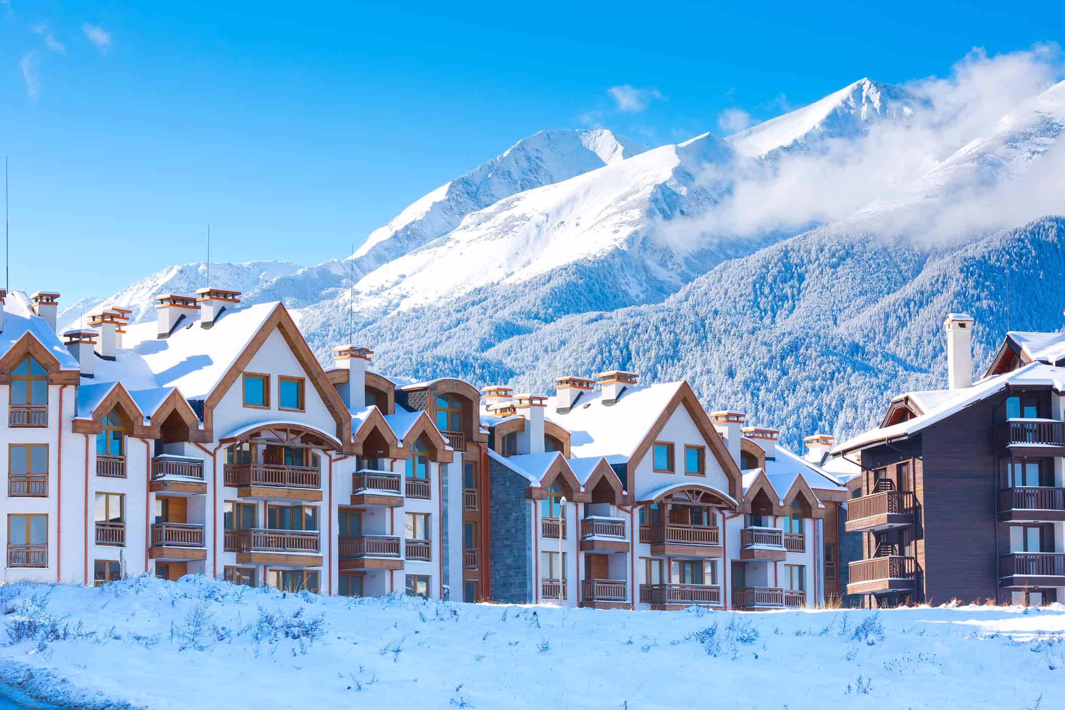 Houses and snow mountains panorama in bulgarian ski resort Bansko