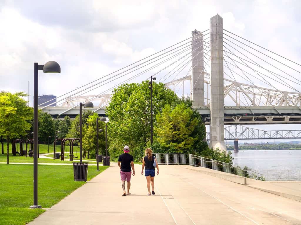 People enjoy the scenic walking path along Waterfront Park in Louisville Kentucky