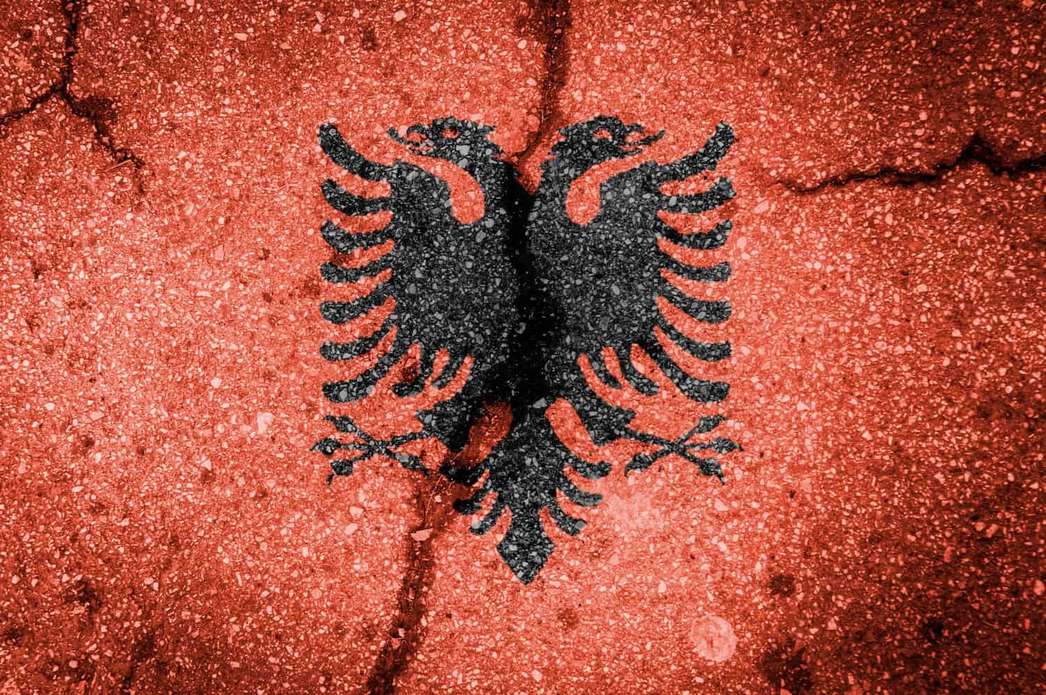 Albania earthquake in November 2019 concept image: albania flag blended on a cracked street