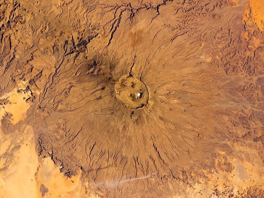 Top view of Emi Koussi Volcano, Chad, the highest of Africa’s Sahara region. Aerial view of a inactive volcanic peak. Elements of this image furnished by NASA. Selective focus.