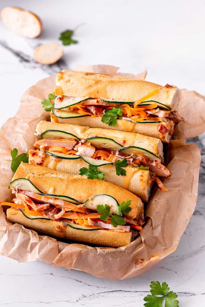 In Vietnamese cuisine, bánh mì or is a short baguette with thin, crisp crust and soft, airy texture. It is often split lengthwise and filled with savory ingredients like a submarine sandwich