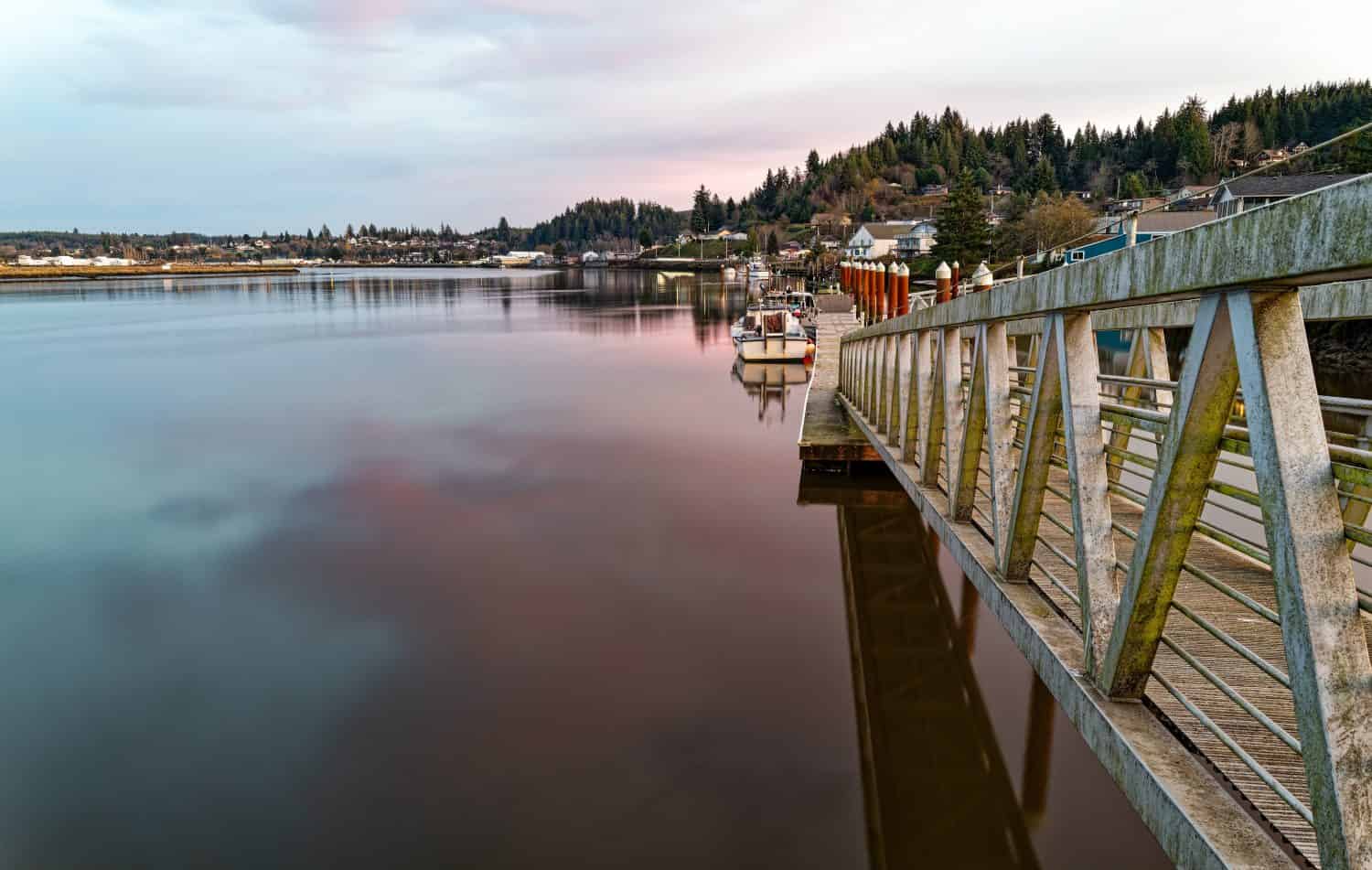 Boat dock at sundown on the Willapa River at South Bend, Washington, USA