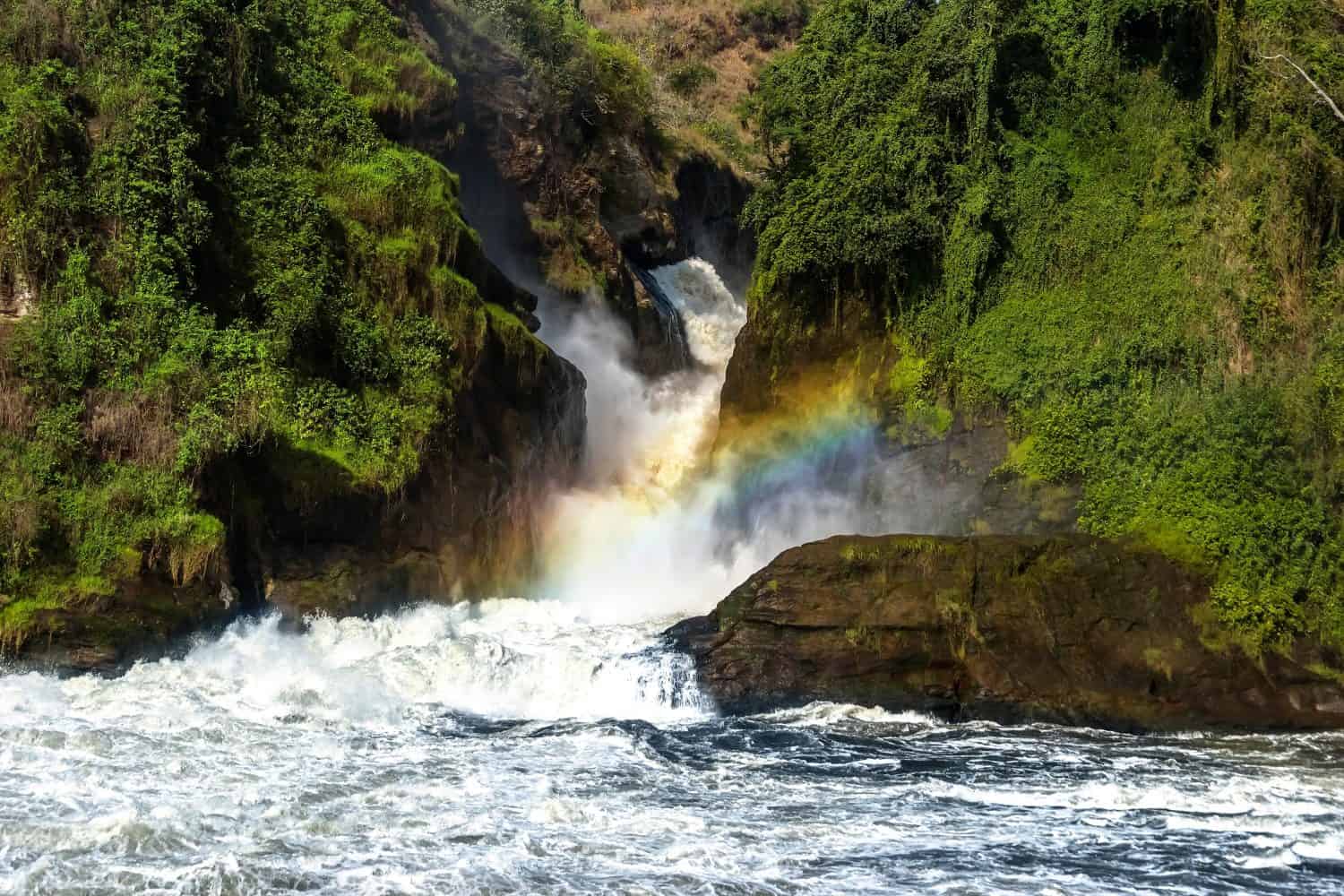 A rainbow over the Murchison waterfall on the Nile river. Murchison falls national park, Uganda.