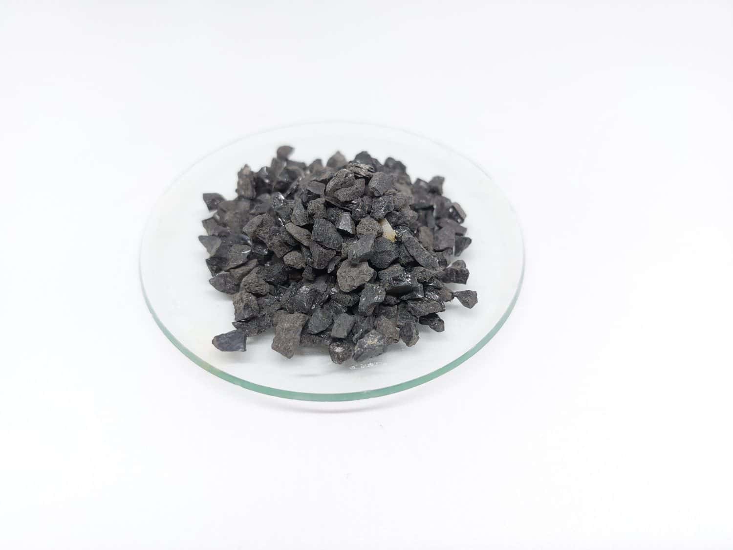 Anthracite commonly used in the water filtration to remove impurities and improve water quality. Anthracite known as hard black coal is acompact variety of coal. Isolated on white background