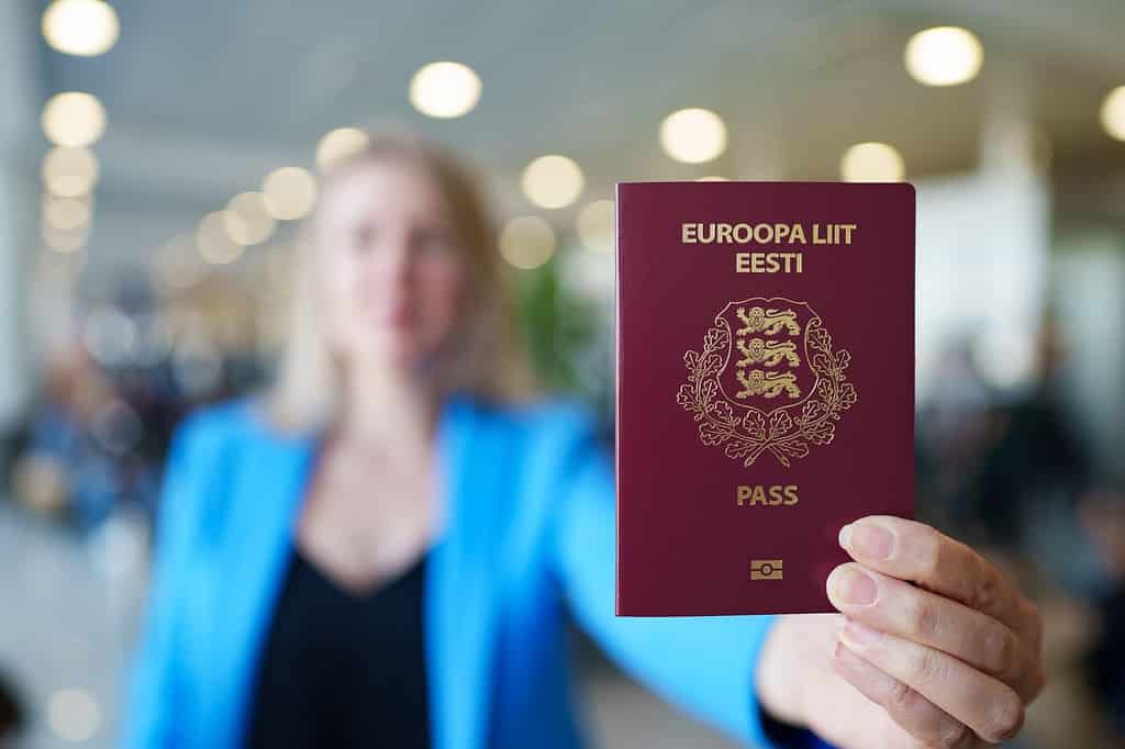 Woman showing europe union passport. Estonian citizenship.