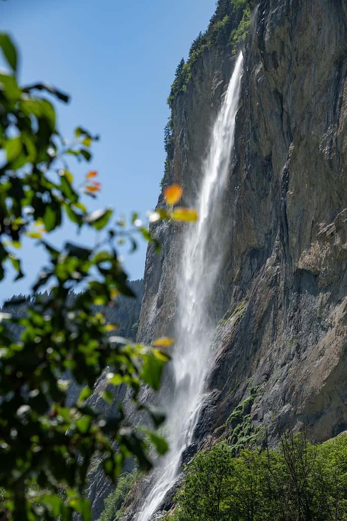 Very tall cascading waterfall in the Swiss alps.