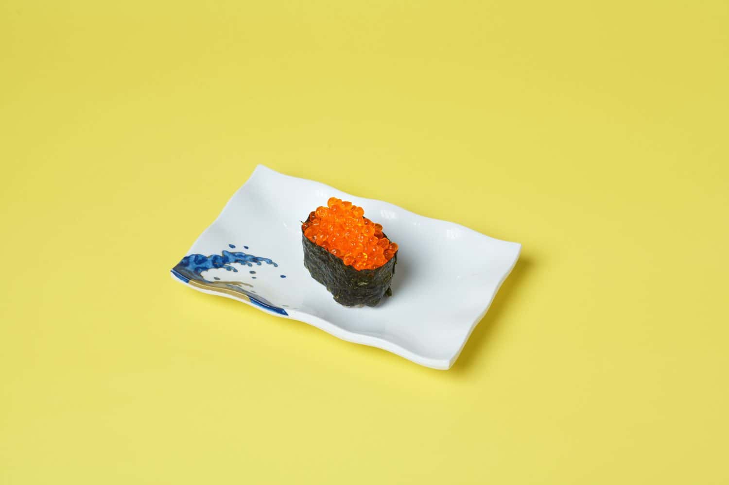 Vegetarian food, Ikura sushi on yellow background.