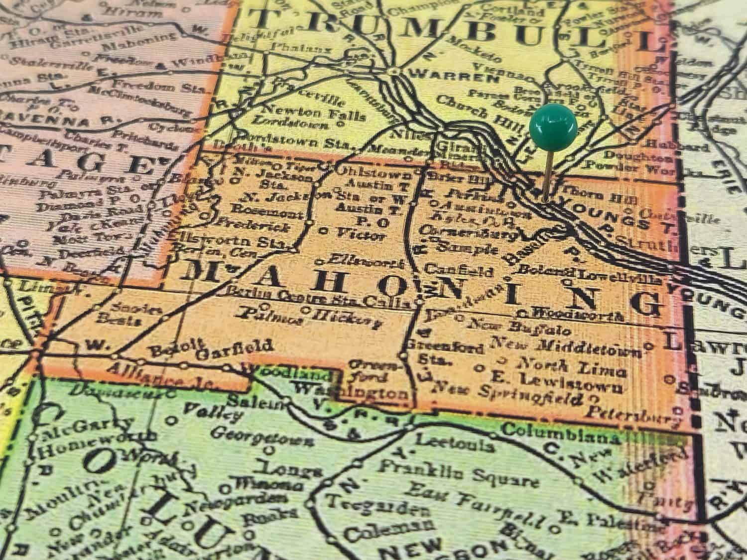 Mahoning County, Ohio marked by a green tack on a colorful vintage map. The county seat is located in the city of Youngstown, OH.