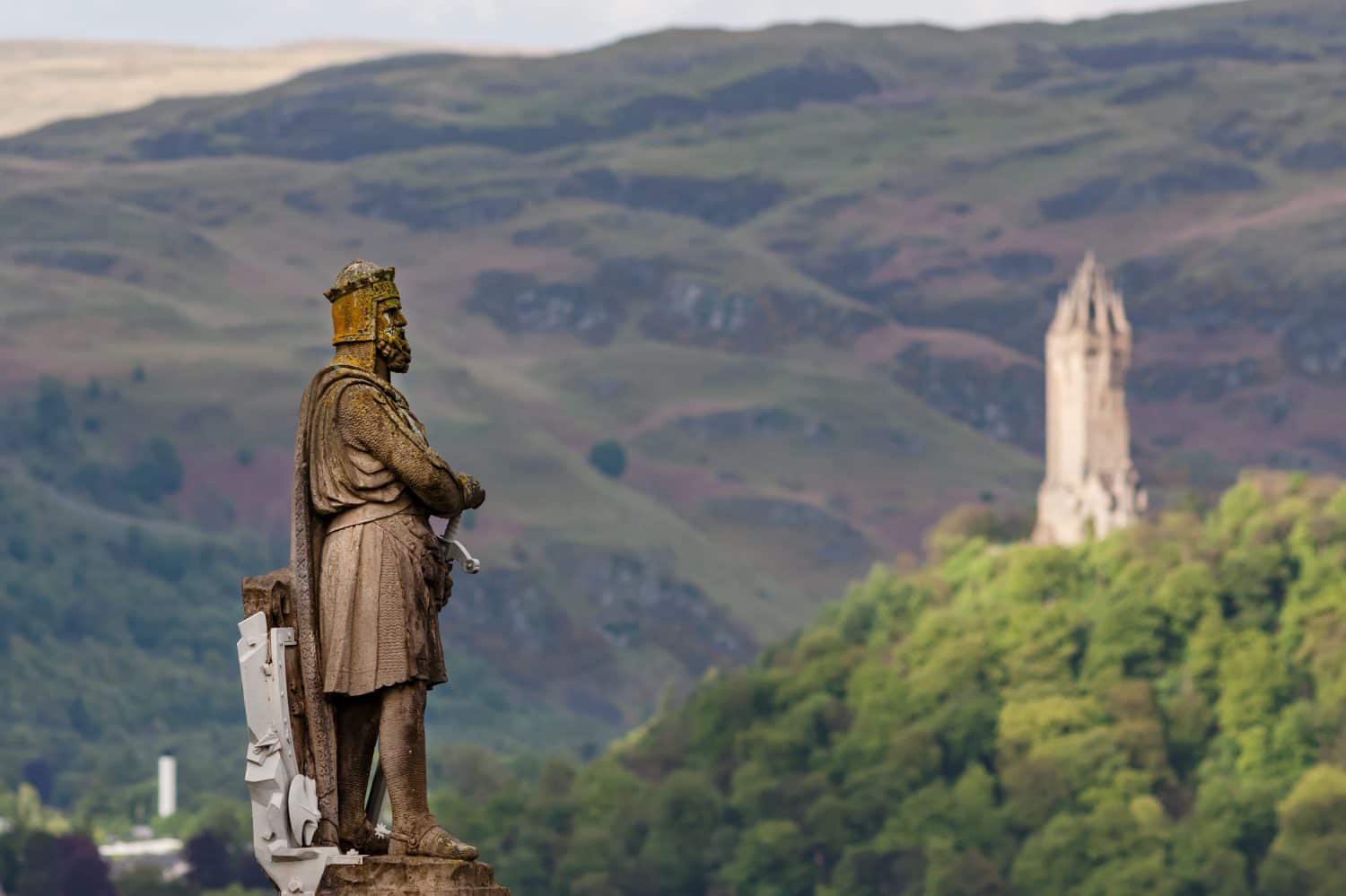 The statue of King Robert I (also known as Robert The Bruce), who secured Scotland's independence from England. In the background National Wallace Monument commemorates Sir William Wallace.