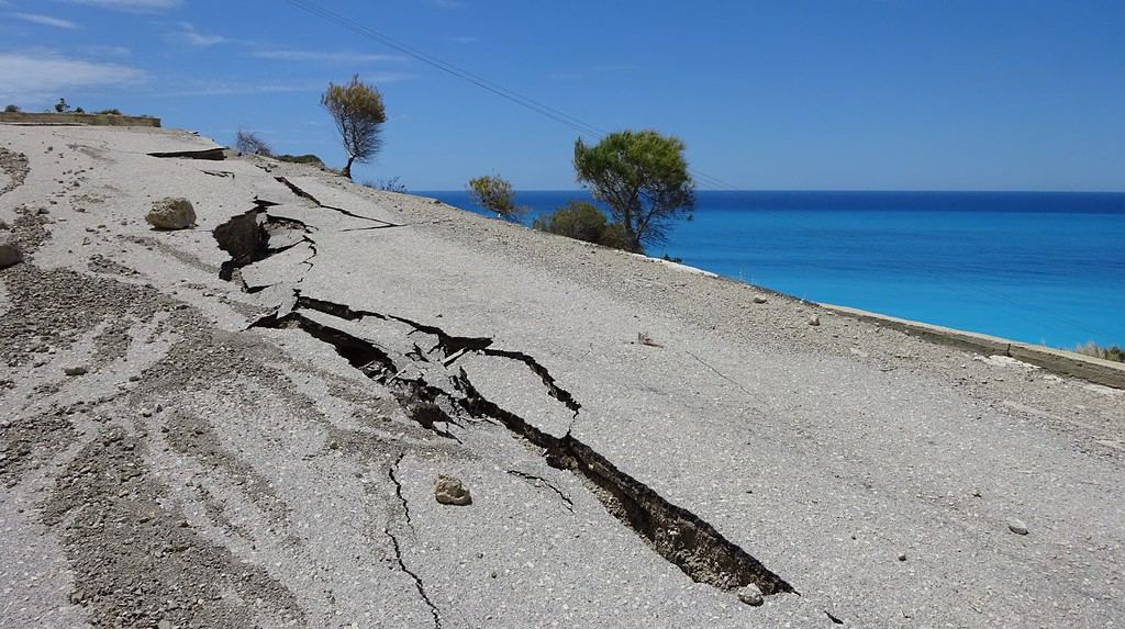 Earthquake damage to a steep coast road leading to Gialou Beach on Lefkas Island, Greece
