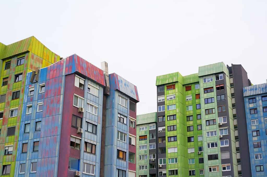 Colorful block of flats in Slovenian city - old and ugly architecture and residential building. Housing project was made in style of brutalism in era of socialist Yugoslavia