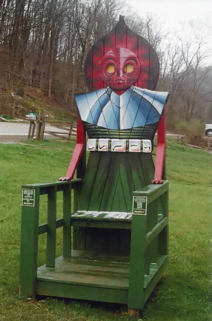 Chair on the lawn by the town hall welcomes visitors to Flatwoods, WV, near the location where the Flatwoods Monster was reported to have been seen.