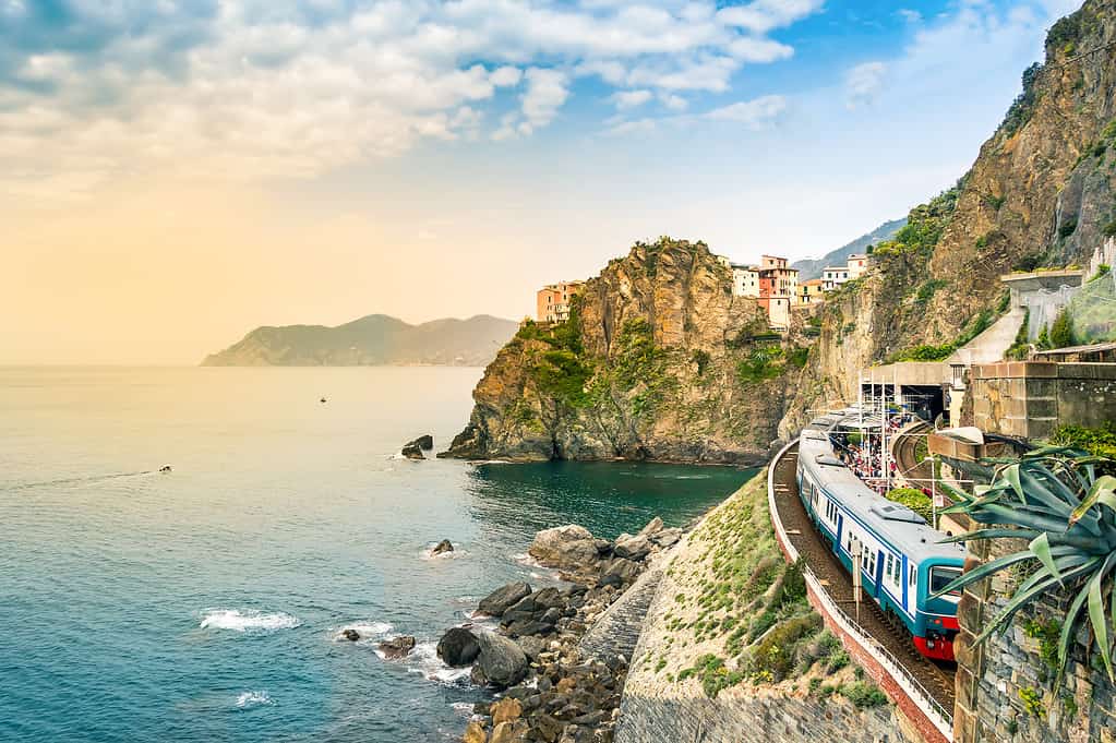 Manarola, Cinque Terre - train station in famous village with colorful houses on cliff over sea in Cinque Terre
