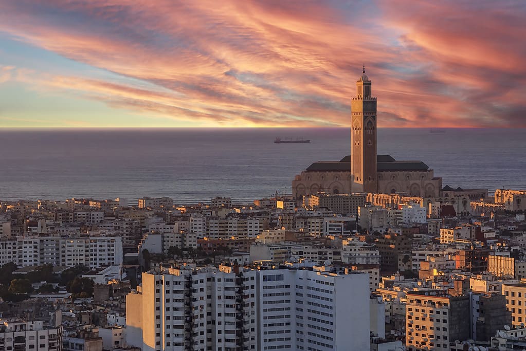 Evening view of Casablanca cityscape with Mosque Hassan II in Morocco