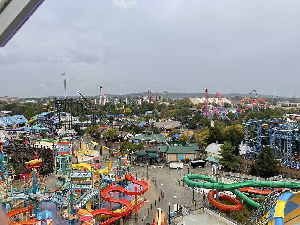 Aerial view of Hersheypark, with the waterpark in the foreground and the roller coasters in the background on a cloudy day