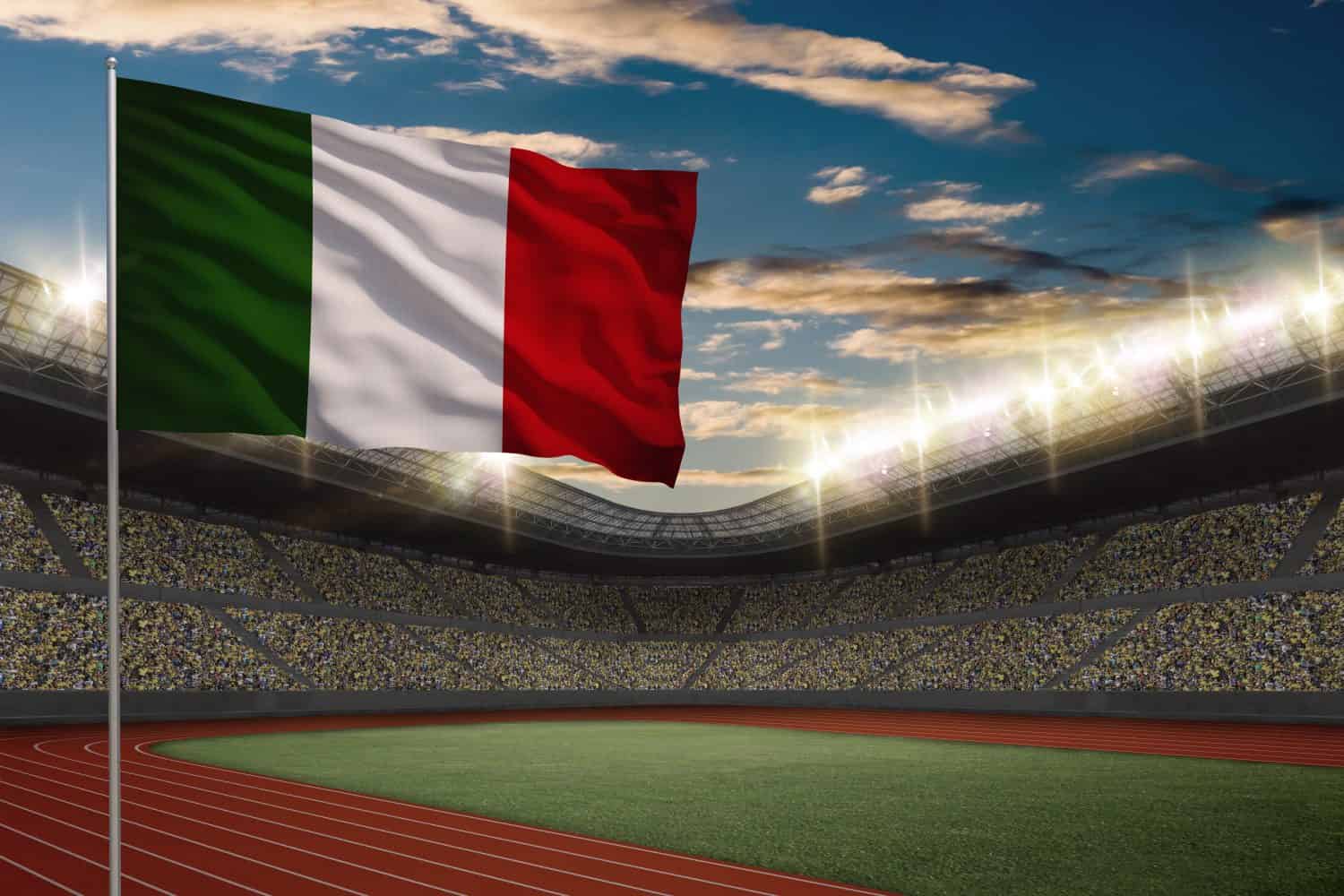 Italian Flag in front of a Track and field Stadium with fans.