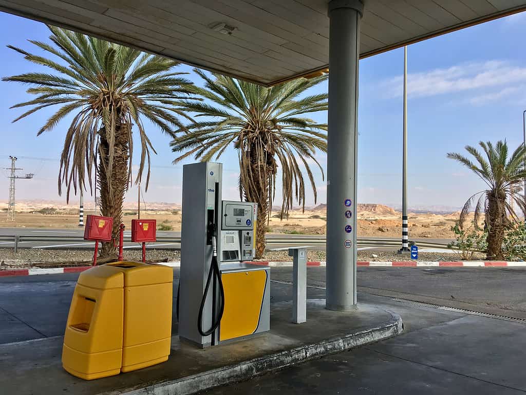 A yellow gas station in the desert of the negev in Israel.