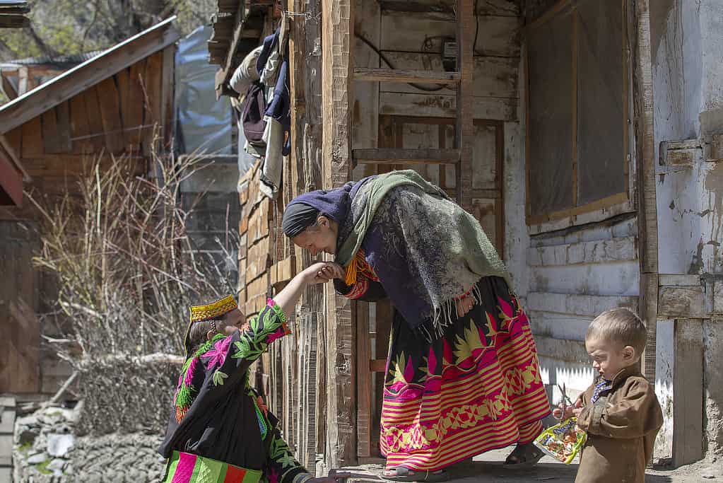 Kalash women greet each other by kissing their hands. - Indigenous Pakistan