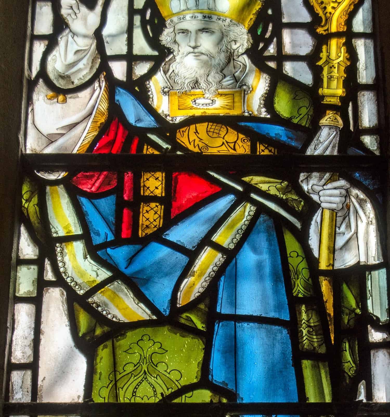 Victorian stained glass window depicting Saint Patrick, standing on one of the snakes he banished from Ireland.  On public display over 100 years.