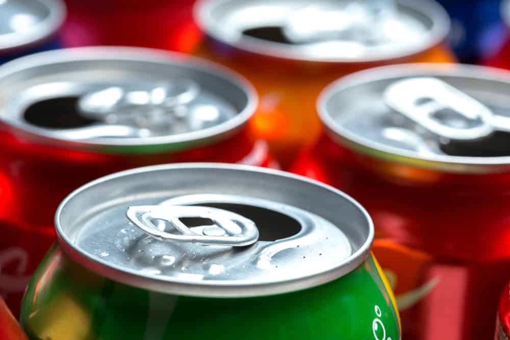 Colorful aluminum cans isolated on white background