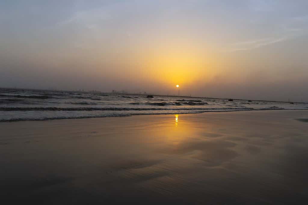 Beautiful sunset at the seashore in Dumas Beach, Surat, Gujarat
