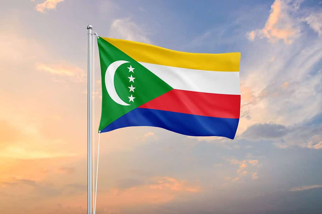 Comoros flag waving on sundown sky