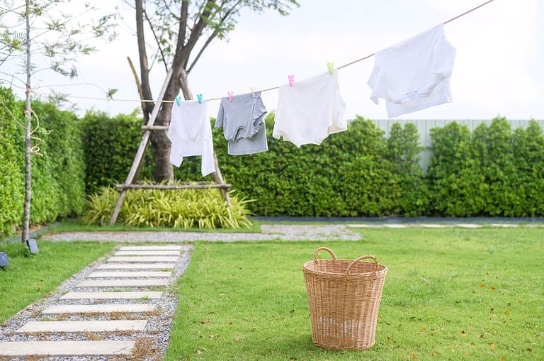 Clothes hanging laundry on washing line for drying against blue sky outdoor
