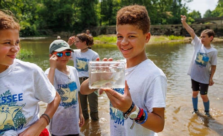 Campers learn about aquatic life as they explore a section of South Chickamauga Creek during the Tennessee Aquarium’s River Guardians specialty summer camp.